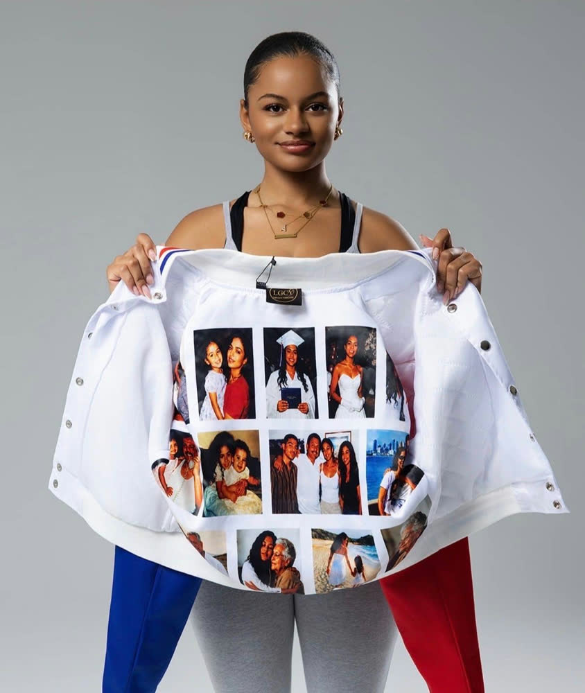 A model holding open a varsity jacket with a custom family photo lining